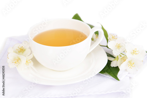 Cup of tea with jasmine isolated on white