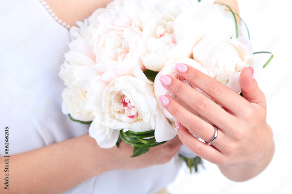 Bride holding wedding bouquet of white peonies, close-up Bride holding wedding bouquet of white peonies, close-up