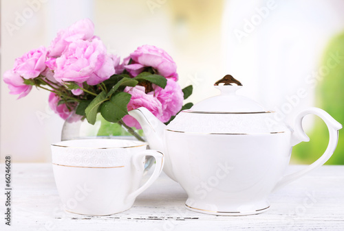 Breakfast tea with  teapot of fresh pink garden roses