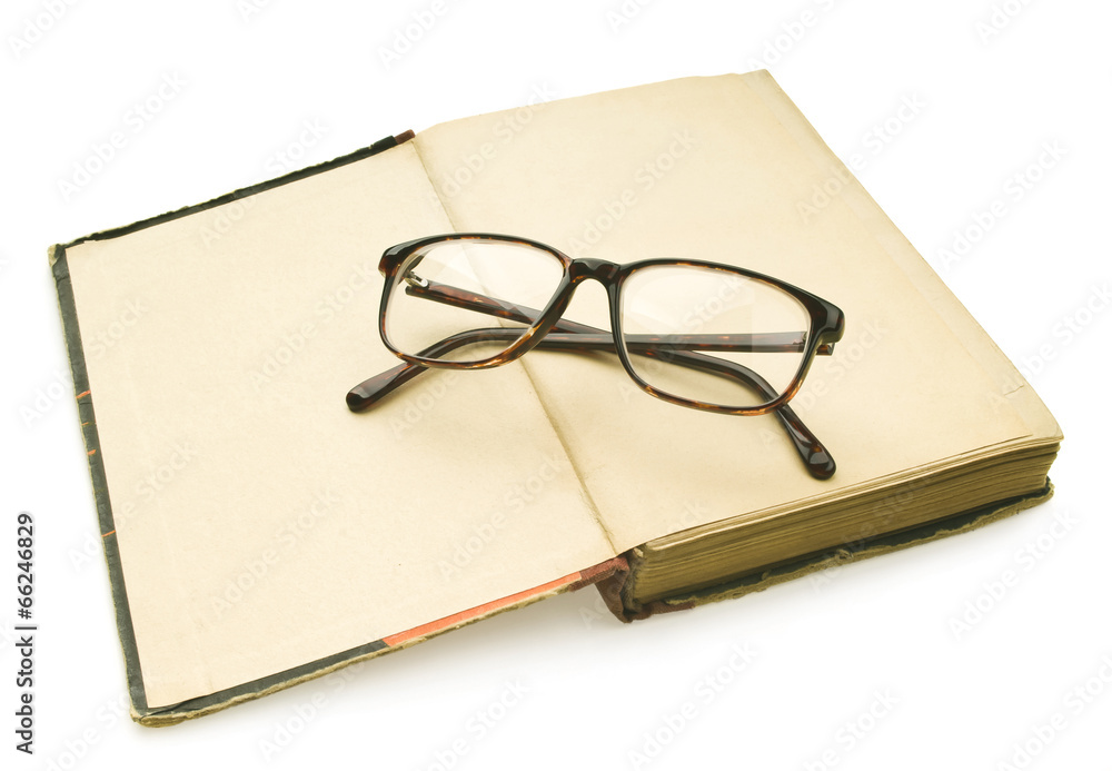 Old books with eye glasses isolated on white background Old books with eye glasses isolated on white background