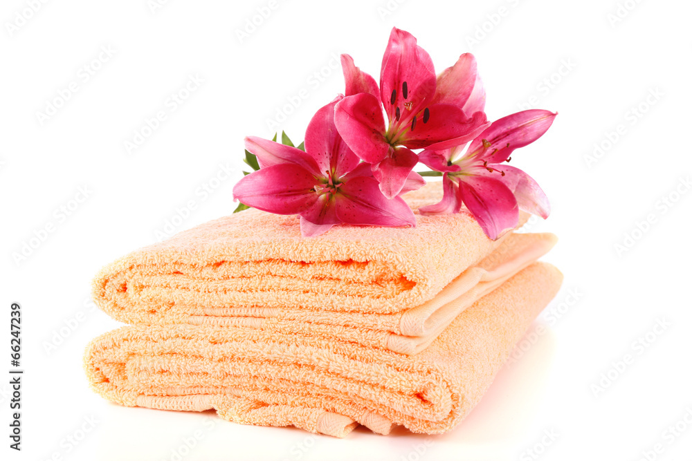 Color towels and lily flowers, isolated on white Color towels and lily flowers, isolated on white