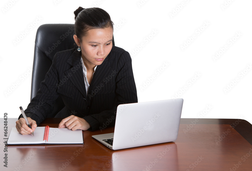 Asian businesswoman at her office desk over white background Asian businesswoman at her office desk over white background