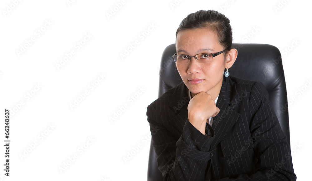 Asian businesswoman sitting at her office chair Asian businesswoman sitting at her office chair