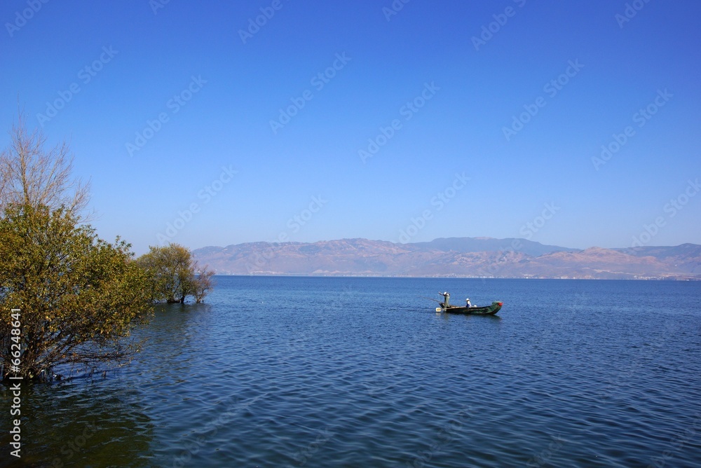 People fishing on Erhai lake, Dali, Yunnan province, China People fishing on Erhai lake, Dali, Yunnan province, China