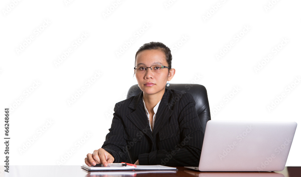 Asian businesswoman at her office desk over white backfground Asian businesswoman at her office desk over white backfground