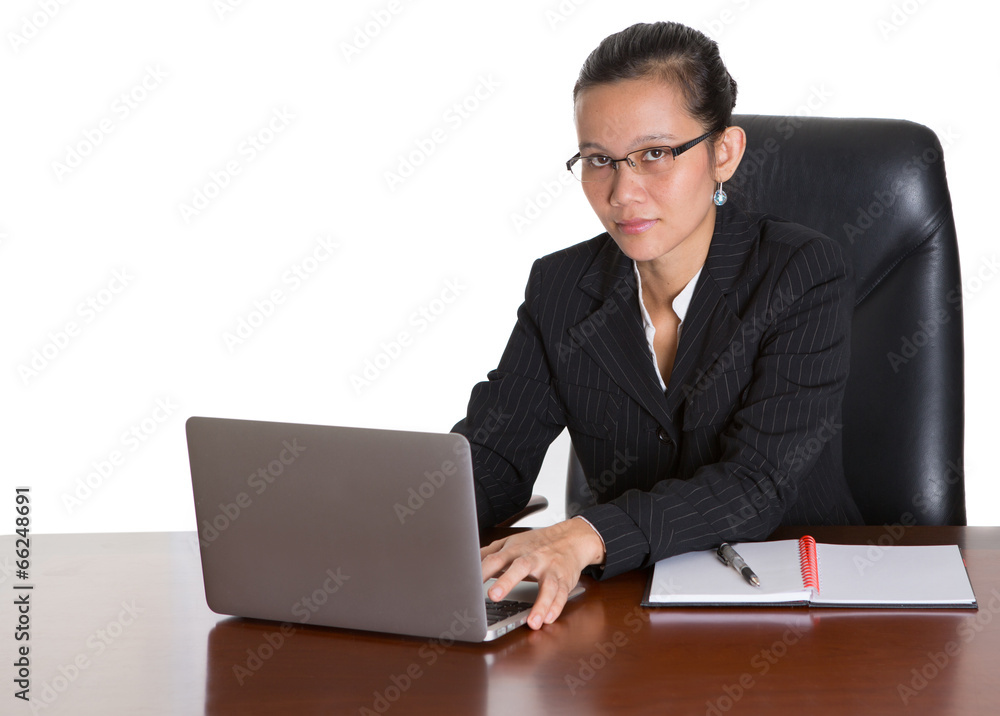 Asian businesswoman at her office desk over white backfground Asian businesswoman at her office desk over white backfground