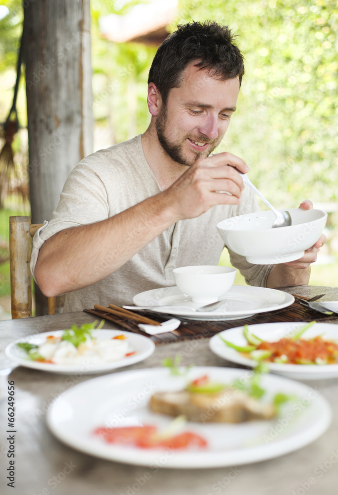 Man enjoying meal at vietnamese restaurant Man enjoying meal at vietnamese restaurant