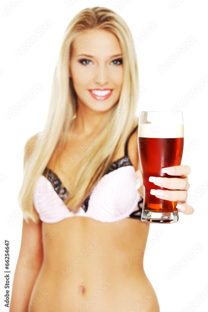 Beautiful and sexy woman holding glass of beer Beautiful and sexy woman holding glass of beer