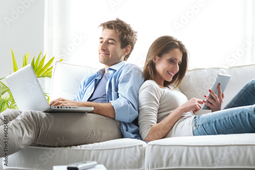 Couple surfing the net at home photo