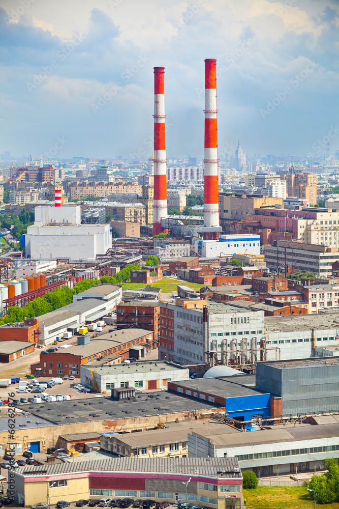 Smoking pipes in the city. Industrial zone in a residential area Smoking pipes in the city. Industrial zone in a residential area