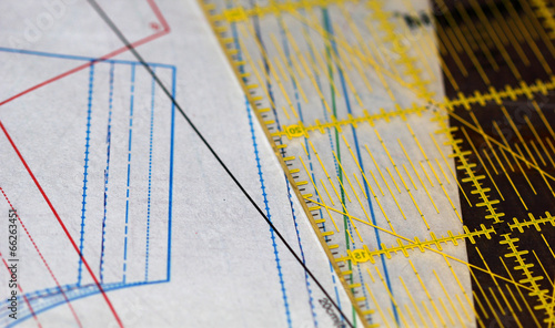 Sewing drawing, ruler and tracing paper laying on the table