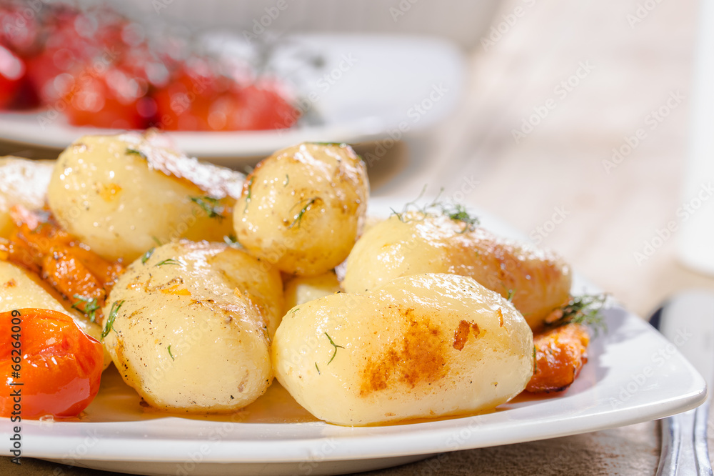 Roasted potatoes with carrot and tomatoes Roasted potatoes with carrot and tomatoes