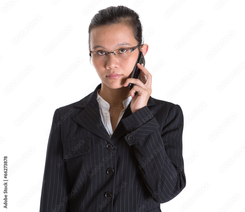 Asian businesswoman with a smart phone over white background Asian businesswoman with a smart phone over white background
