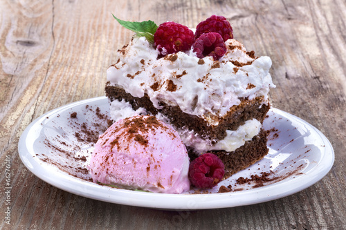 Sweet summer cake with ice cream and raspberries