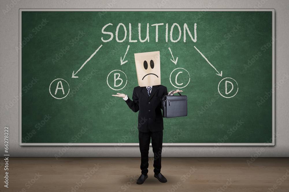 Confused businessman finding solution Confused businessman finding solution