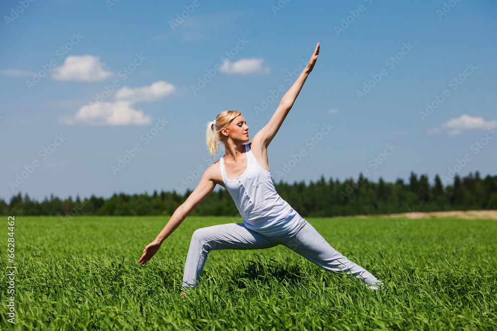 Beautiful young blonde healthy woman doing yoga exercise on Beautiful young blonde healthy woman doing yoga exercise on