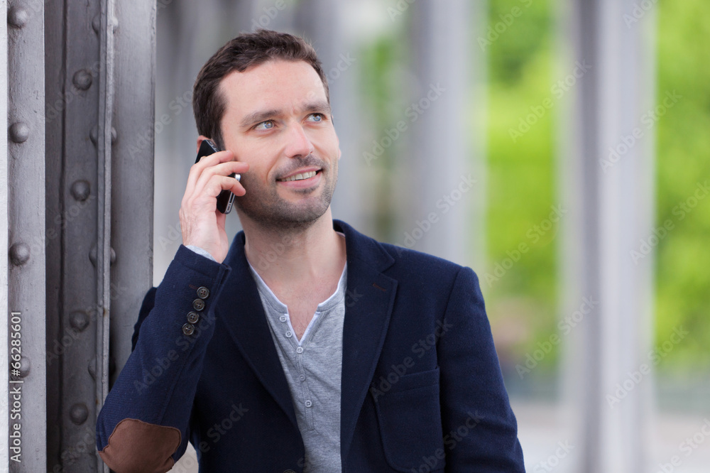 Young attractive man using smartphone in Paris Young attractive man using smartphone in Paris