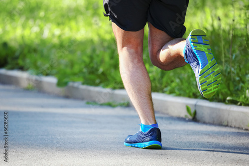 Young man running outdoors in the morning.