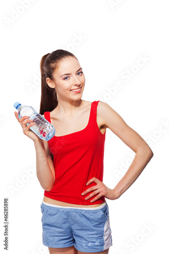 sporty smiling healthy woman with bottle of water