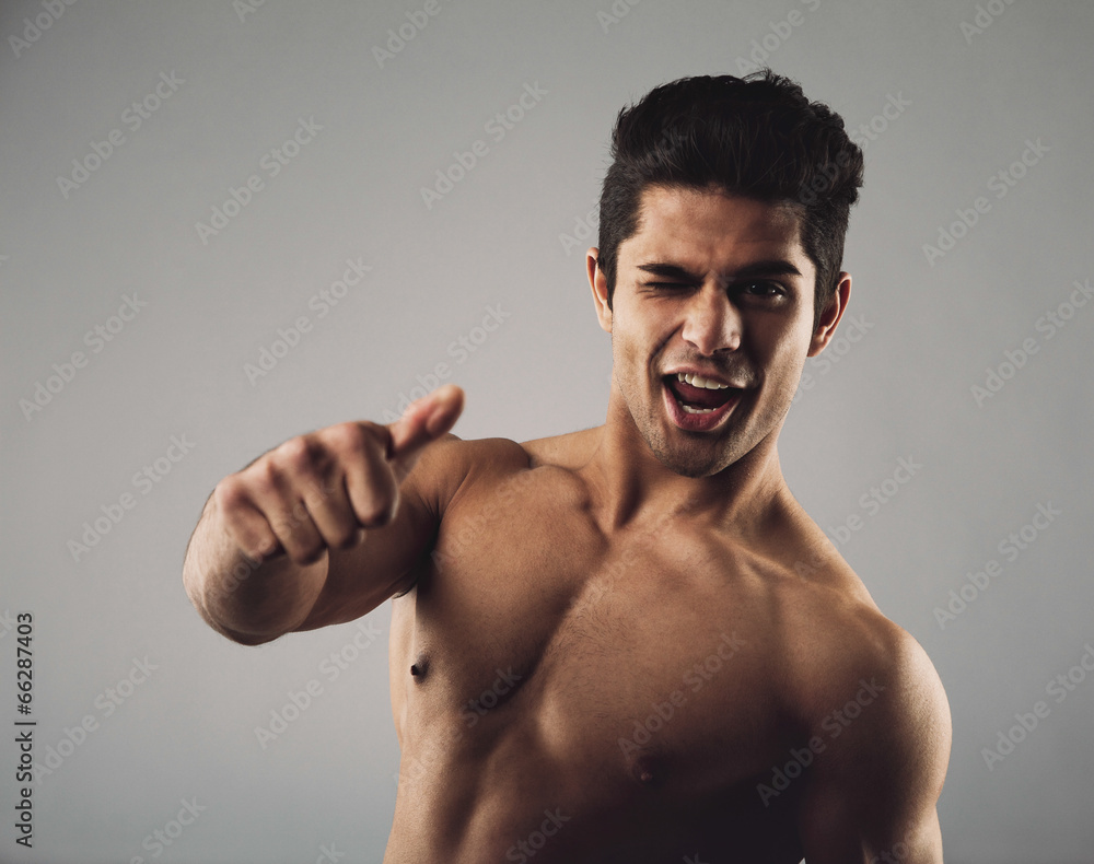 Fototapeta premium Happy masculine man showing thumbs up sign