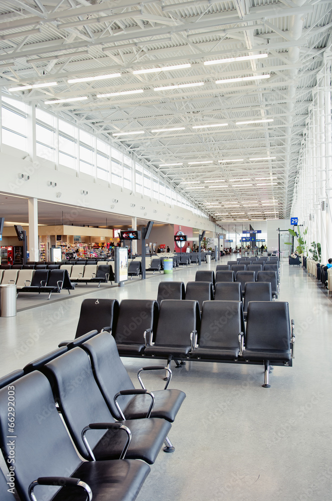 Fototapeta premium Modern airport terminal waiting room with window