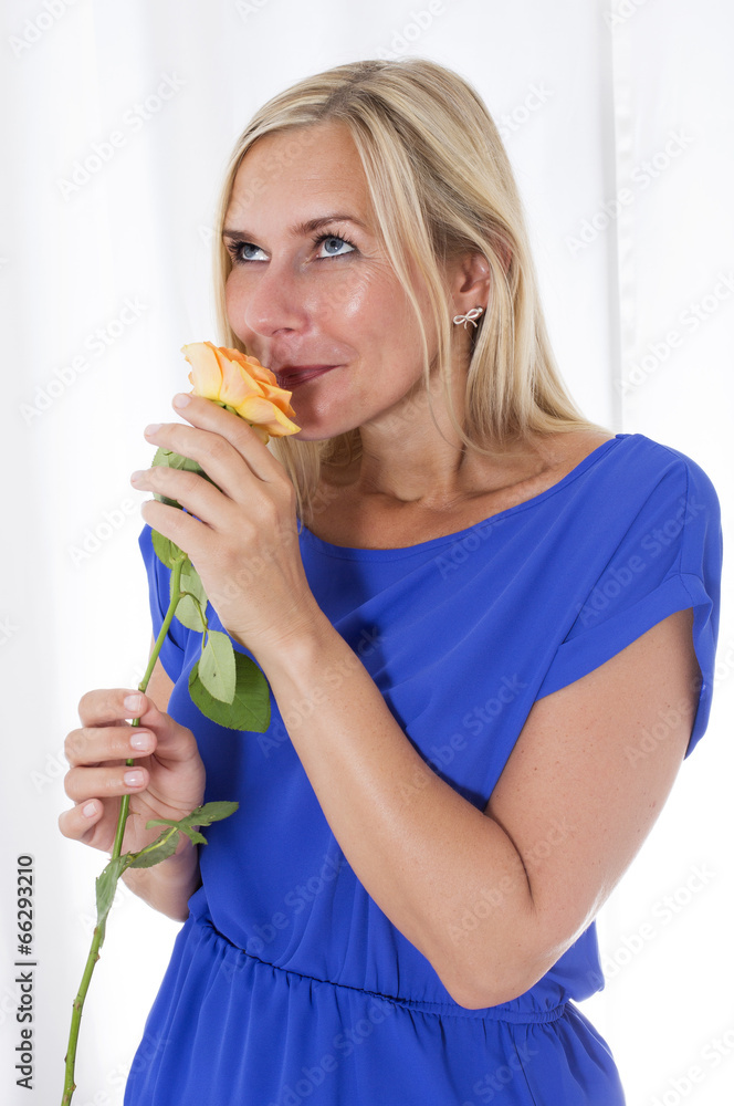 woman smelling a rose woman smelling a rose