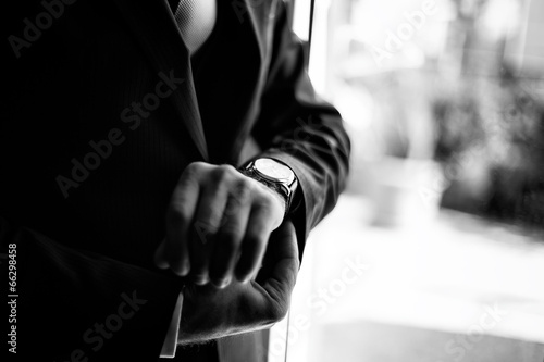 Groom closes the watchband