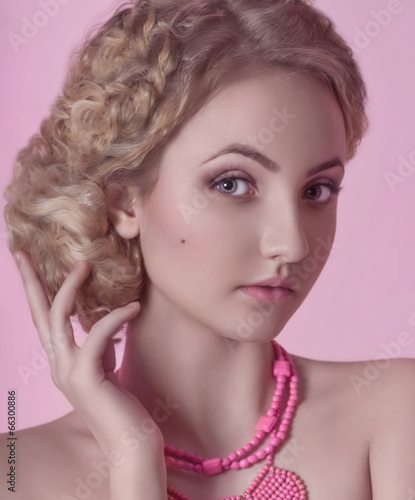 Portrait of beautiful young blonde woman with makeup