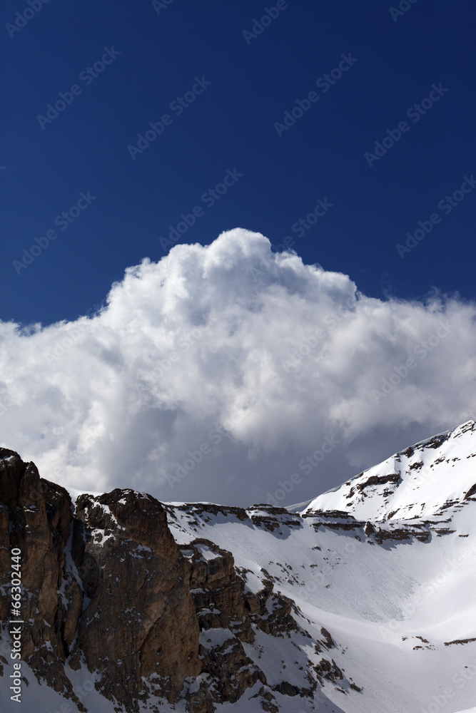 Snowy rocks with snow cornice