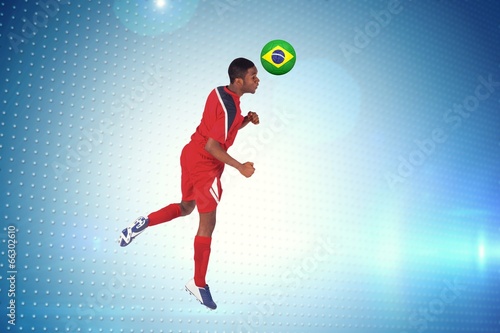 Composite image of football player in red jumping © WavebreakmediaMicro