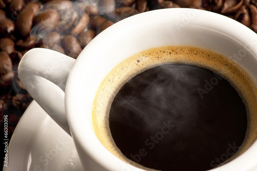 cup of coffee with cfee beans photo