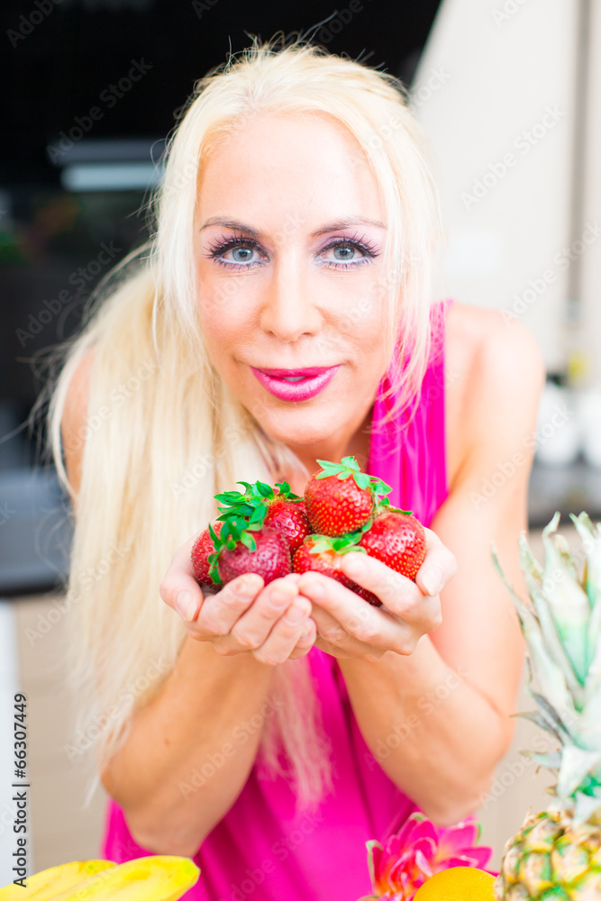 Happy woman cooks in the kitchen Happy woman cooks in the kitchen