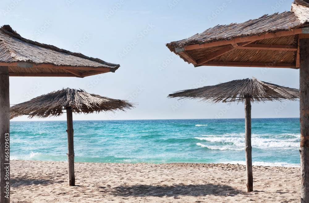 pure tropical sea beach with the straw beach umbrellas pure tropical sea beach with the straw beach umbrellas