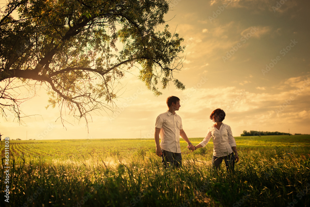 Happy couple outdoor, summertime, tinted photo