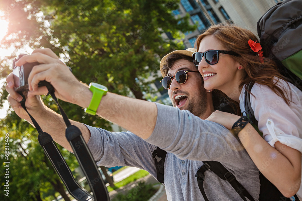 Naklejka premium Two Tourists Taking Selfie