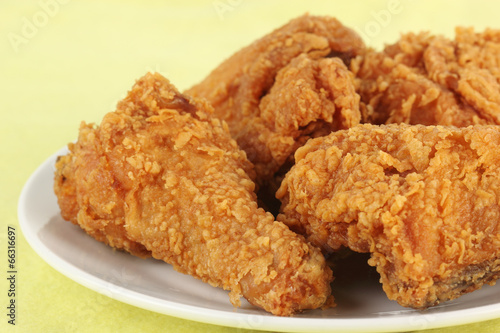 Fresh fried chicken on a white plate