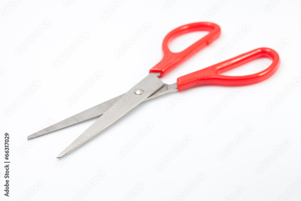 Red scissors on white background Red scissors on white background