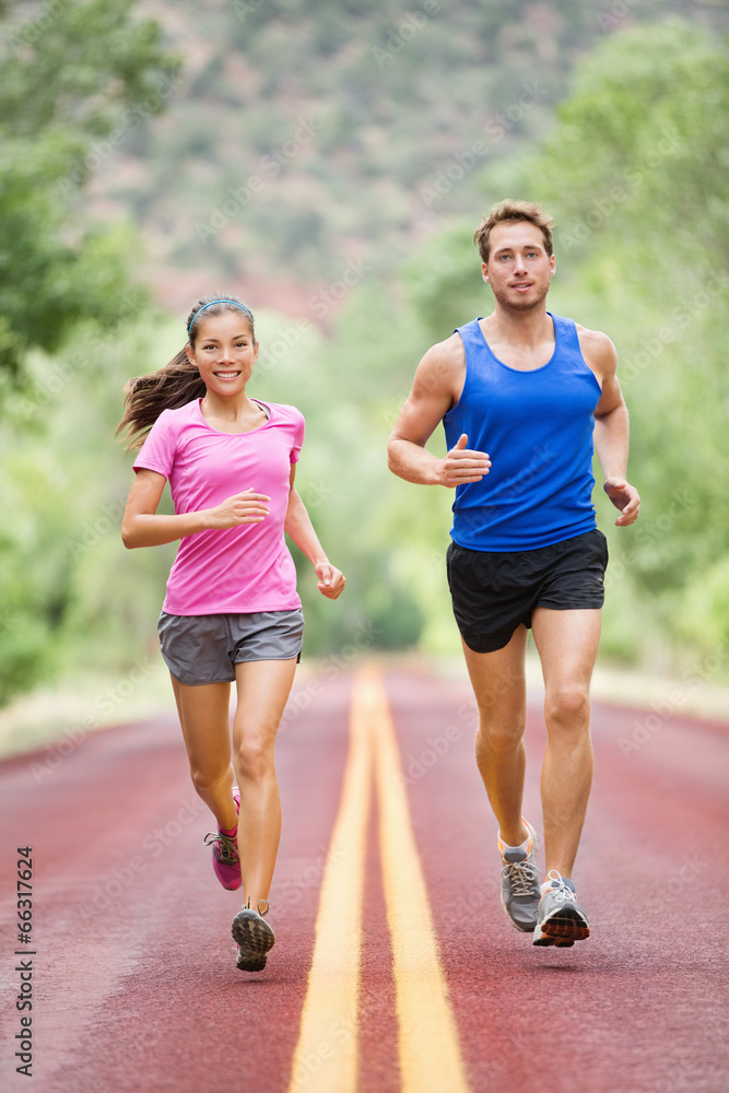 Running people - two smiling runners jogging Running people - two smiling runners jogging