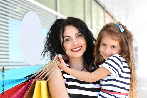 Happy mom and daughter with...