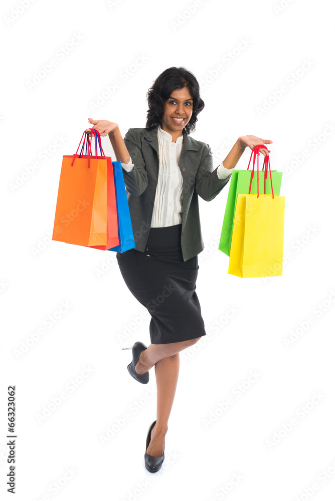 indian woman jumping in joy during shopping spree indian woman jumping in joy during shopping spree