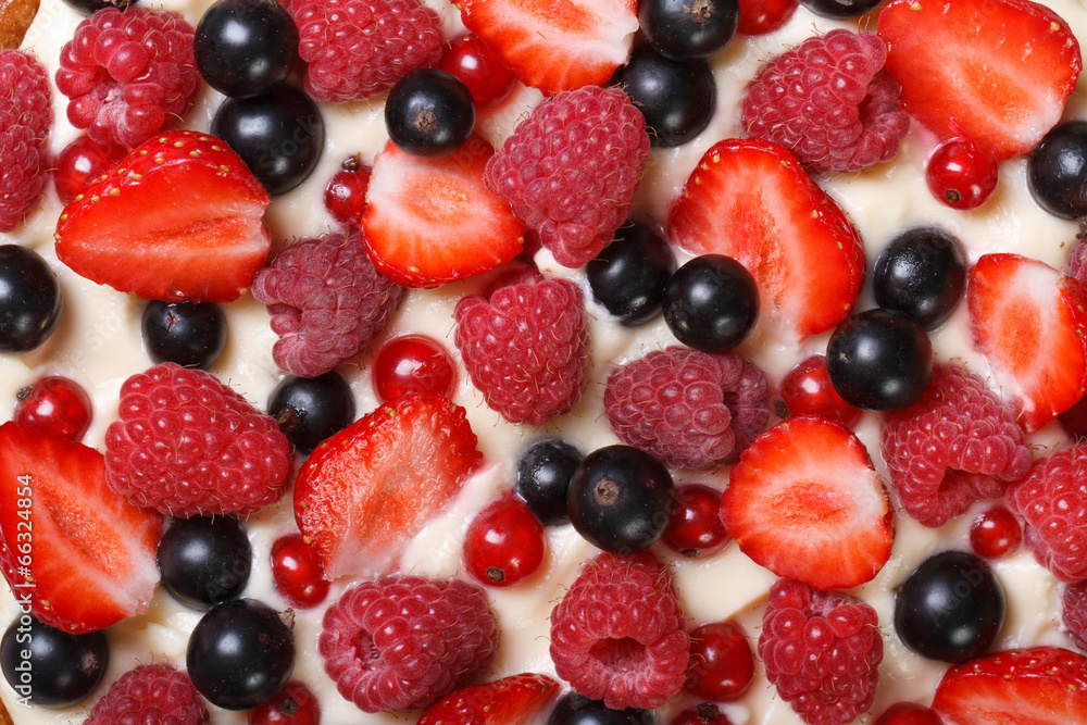 Background of strawberries, raspberries and currants with cream Background of strawberries, raspberries and currants with cream