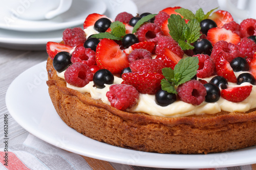 delicious berry tart with strawberries, raspberries, mint
