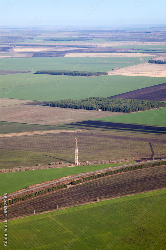 Telecommunication tower on an agriculture fields