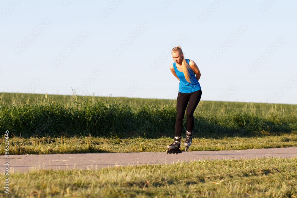 Woman rollerblading in summer evening Woman rollerblading in summer evening