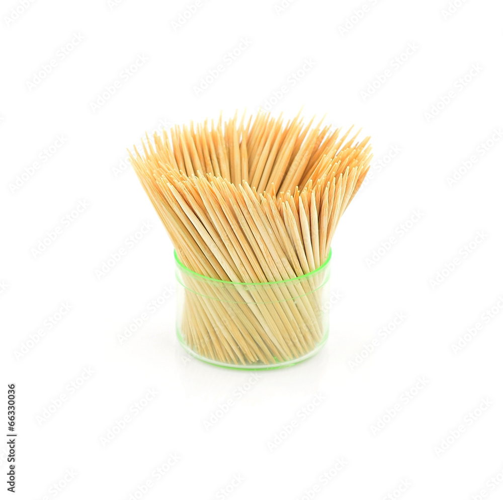 Toothpicks in transparent plastic box on a white background