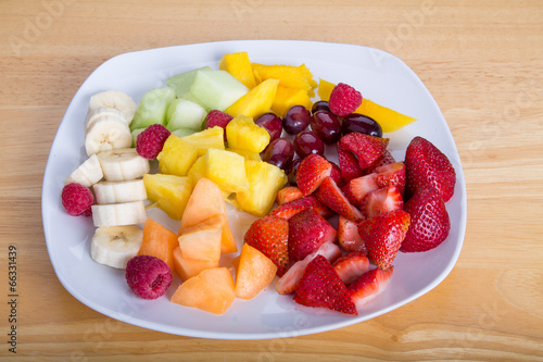 Cut Fruit with Mangos Bananas Berries Melons and Pineapple