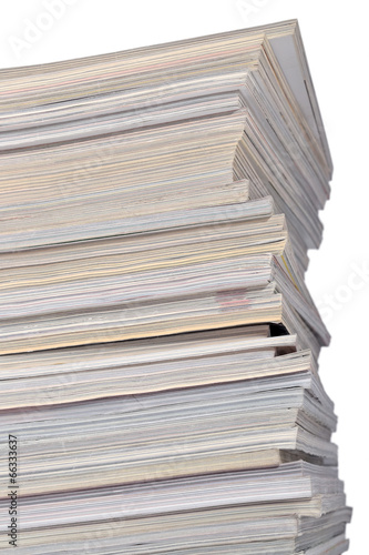 Stack of old magazines on a white