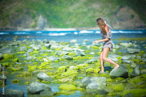 Fototapeta Naklejka Na Ścianę i Meble -  Woman Walking on the Green Reef