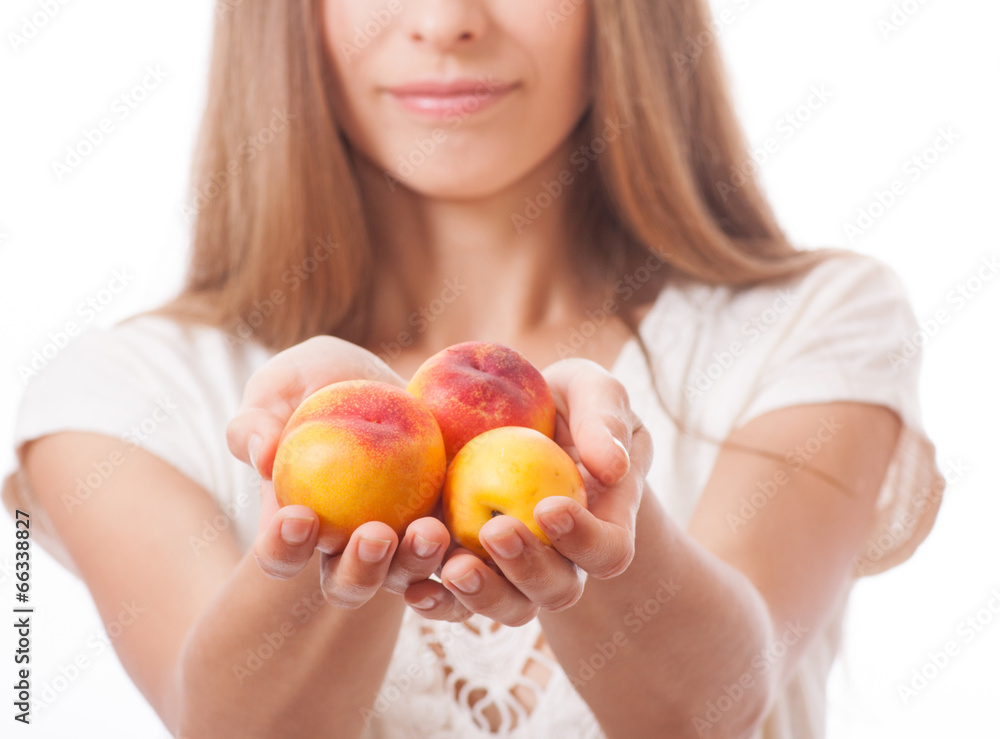 peaches in hand, isolated on white peaches in hand, isolated on white