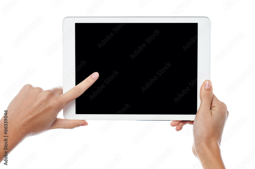 Finger being pointed on tablet screen Finger being pointed on tablet screen